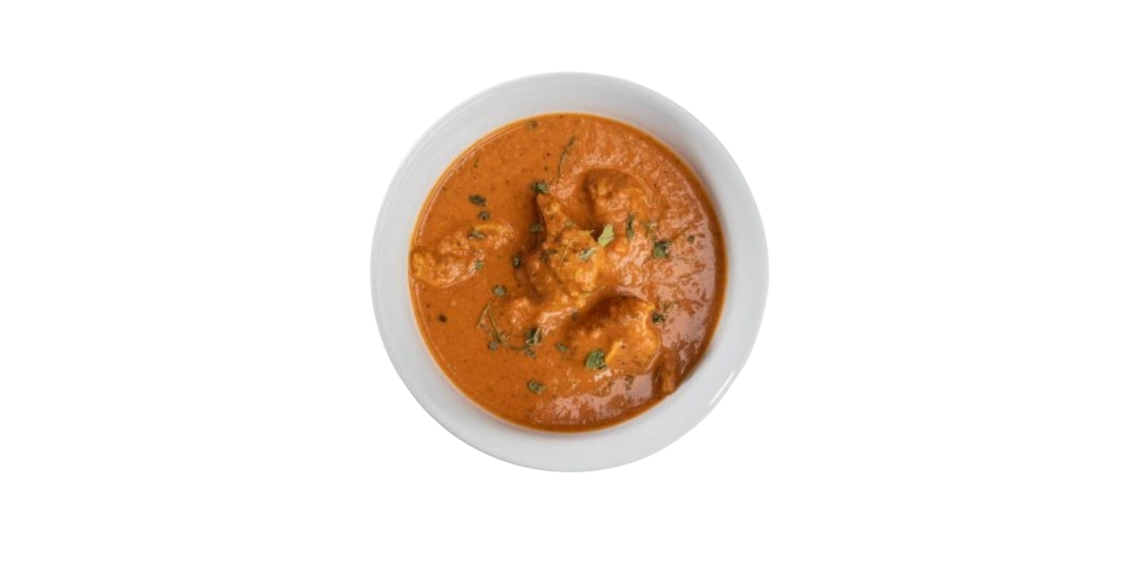 pohled shora na kuřecí tikka masala v kulatém talíři